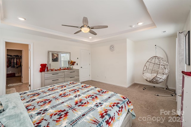 bedroom featuring baseboards, a tray ceiling, recessed lighting, and ornamental molding