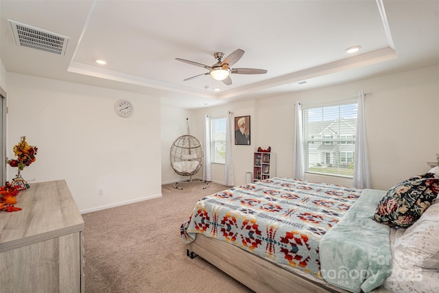 bedroom with a tray ceiling, carpet, baseboards, visible vents, and recessed lighting