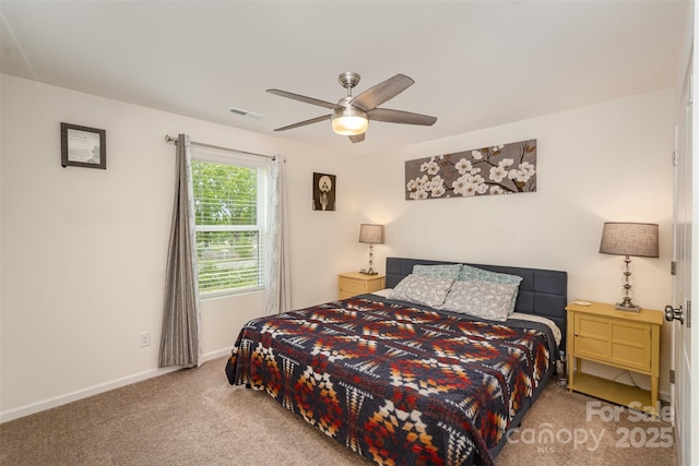 bedroom with baseboards, visible vents, carpet, and ceiling fan