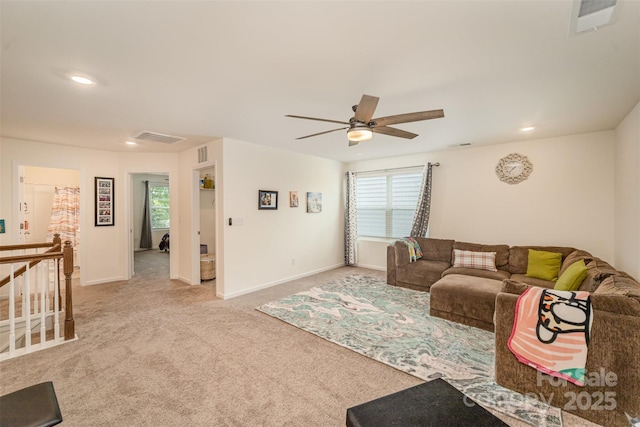 carpeted living room featuring ceiling fan, baseboards, visible vents, and recessed lighting