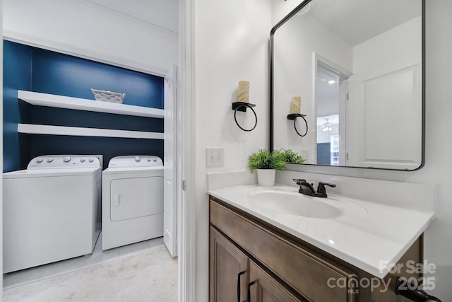 bathroom featuring washer and dryer and vanity
