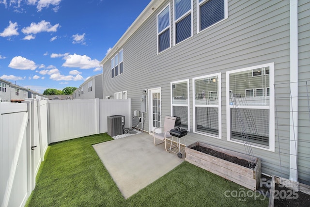 view of patio with a fenced backyard and central air condition unit