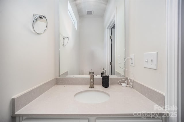 bathroom featuring vanity and visible vents