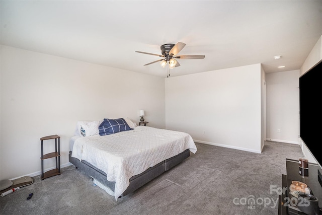 bedroom with carpet, baseboards, and a ceiling fan