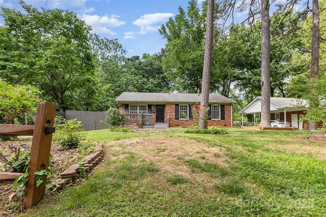 ranch-style house featuring brick siding and covered porch