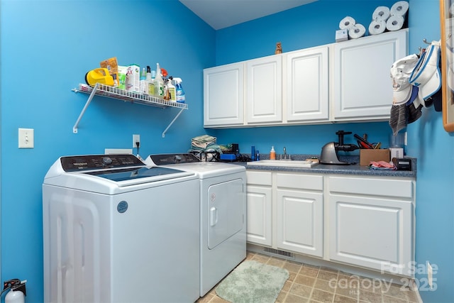 27 Hunting Lodge Dr, Black Mountain, NC 28711 - clothes washing area with visible vents, a sink, cabinet space, and washer and dryer