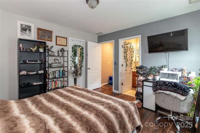 4924 Riverdale Dr, Charlotte, NC 28273 - bedroom with dark wood finished floors, visible vents, and baseboards