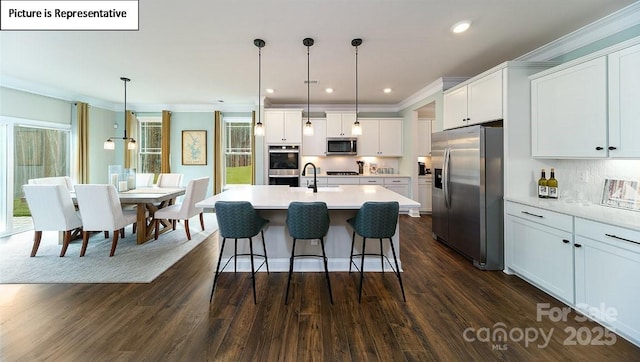 152 Ventor Way, Mooresville, NC 28115 - kitchen featuring ornamental molding, a sink, white cabinetry, a kitchen breakfast bar, and appliances with stainless steel finishes