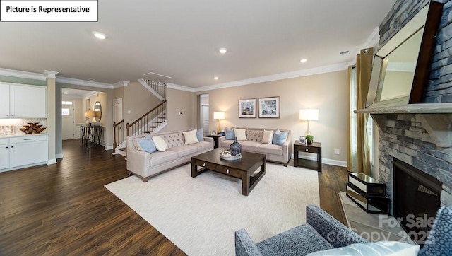 152 Ventor Way, Mooresville, NC 28115 - living room featuring baseboards, a stone fireplace, dark wood finished floors, stairs, and crown molding