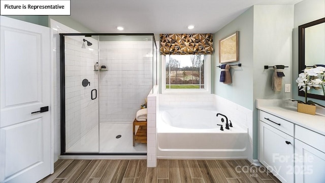152 Ventor Way, Mooresville, NC 28115 - full bathroom with a garden tub, vanity, wood finished floors, and a shower stall