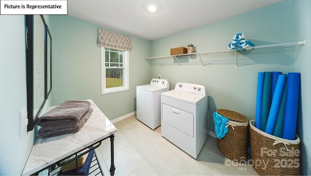152 Ventor Way, Mooresville, NC 28115 - laundry area featuring laundry area, baseboards, light tile patterned floors, and washer and dryer