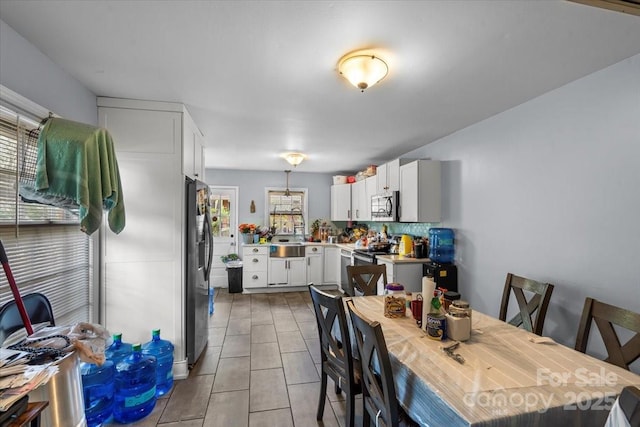 3612 Winterfield Pl, Charlotte, NC 28205 - dining room with light tile patterned floors