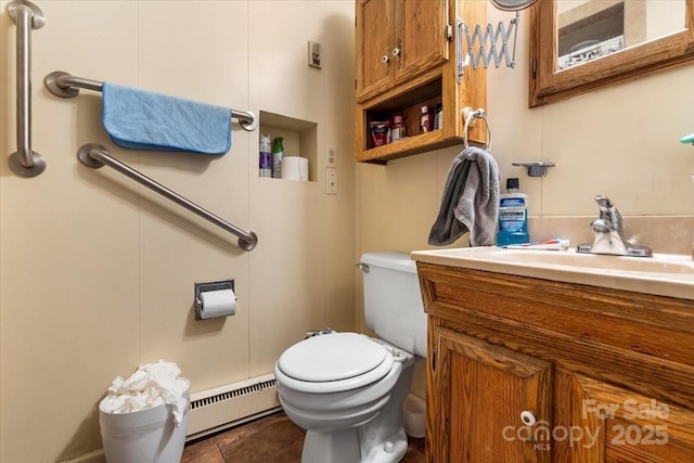 3612 Winterfield Pl, Charlotte, NC 28205 - bathroom featuring toilet, a baseboard heating unit, and vanity