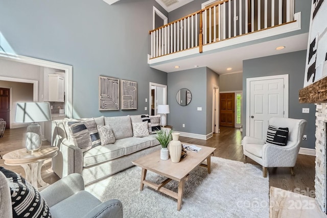 119 Taylor Ct, Mooresville, NC 28117 - living area featuring baseboards, recessed lighting, a towering ceiling, and wood finished floors