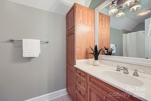 119 Taylor Ct, Mooresville, NC 28117 - bathroom featuring tile patterned floors, vaulted ceiling, and vanity