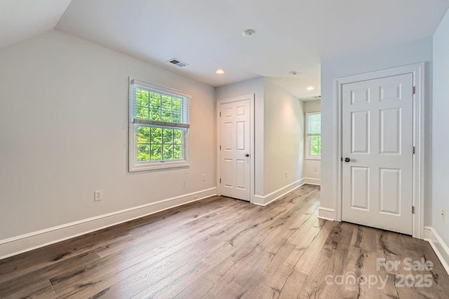 119 Taylor Ct, Mooresville, NC 28117 - unfurnished bedroom with recessed lighting, baseboards, multiple windows, and hardwood / wood-style flooring