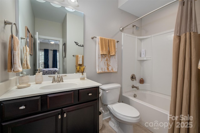 ensuite bathroom featuring shower / bath combo with shower curtain, vanity, ensuite bath, and toilet