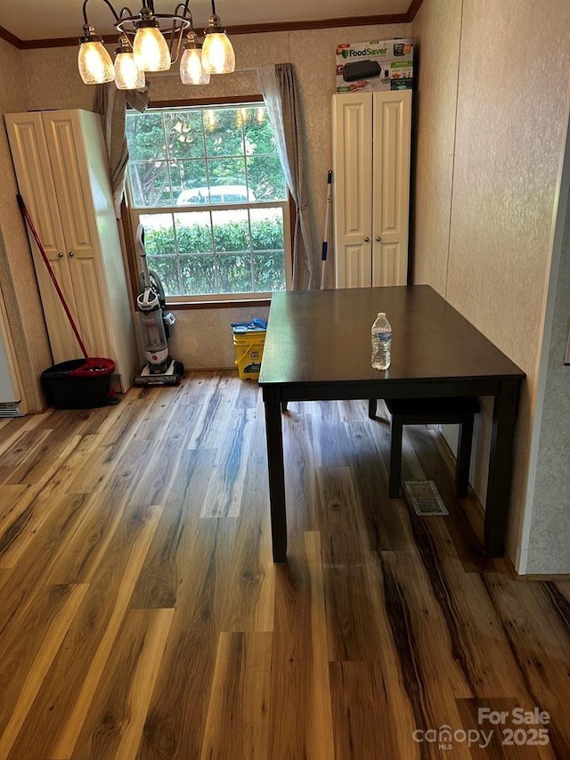 27 Venice Pl, Canton, NC 28716 - dining space with ornamental molding, wood finished floors, and a textured wall