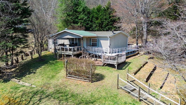 27 Venice Pl, Canton, NC 28716 - view of front of property with a front yard, a vegetable garden, and a wooden deck