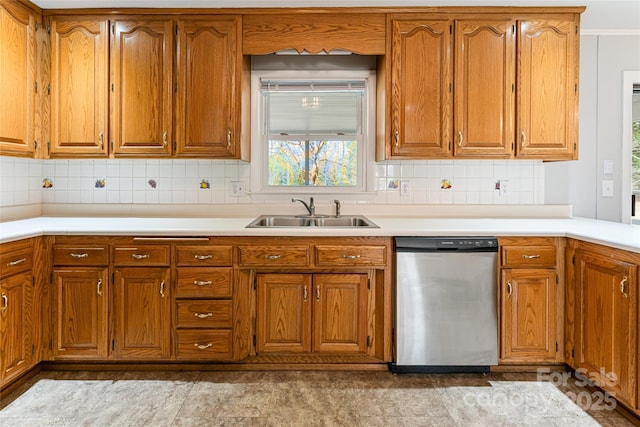 kitchen with a sink, light countertops, brown cabinets, and dishwasher