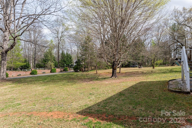 view of yard featuring playground community