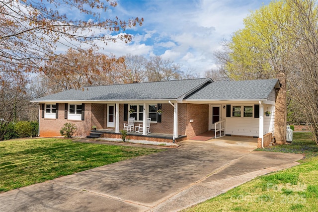 ranch-style house featuring covered porch, concrete driveway, a front lawn, a carport, and a shingled roof