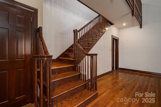 418 3rd St NE, Hickory, NC 28601 - staircase with baseboards and wood finished floors