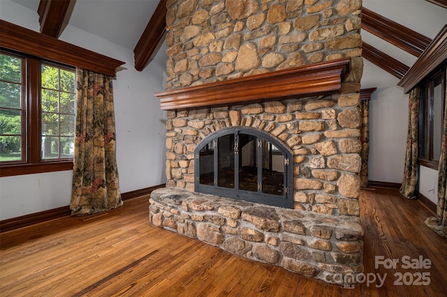 418 3rd St NE, Hickory, NC 28601 - room details with baseboards, wood finished floors, beam ceiling, and a fireplace