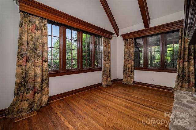 418 3rd St NE, Hickory, NC 28601 - spare room with plenty of natural light, baseboards, and lofted ceiling with beams