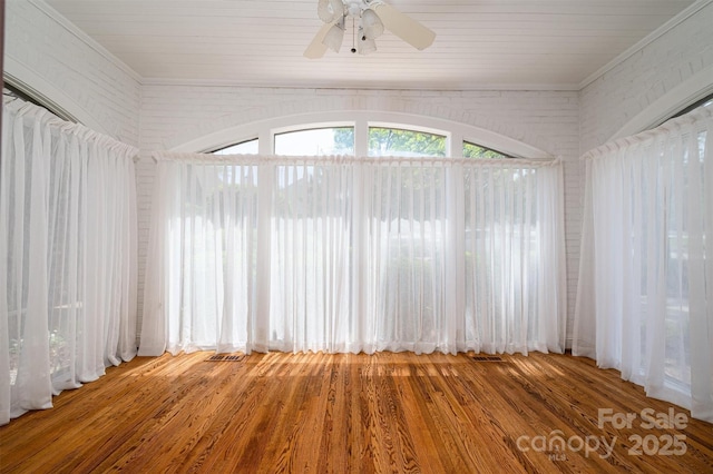 418 3rd St NE, Hickory, NC 28601 - empty room featuring crown molding, wood finished floors, visible vents, and a ceiling fan