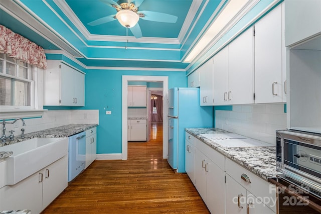418 3rd St NE, Hickory, NC 28601 - kitchen featuring a raised ceiling, a ceiling fan, white appliances, crown molding, and dark wood-style flooring