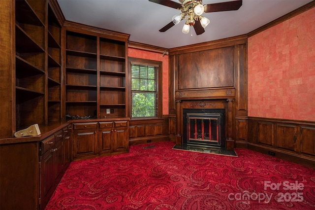 418 3rd St NE, Hickory, NC 28601 - unfurnished living room with a fireplace, dark colored carpet, ceiling fan, and wainscoting