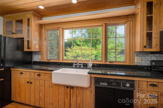 418 3rd St NE, Hickory, NC 28601 - kitchen with decorative backsplash, a sink, black appliances, and a healthy amount of sunlight