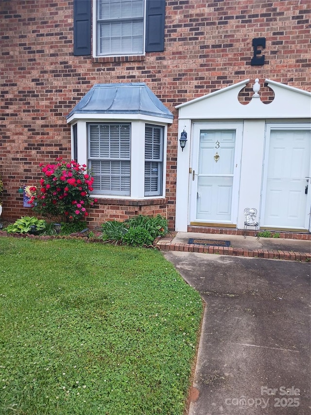 160 17th Street Pl NW Unit 3E, Hickory, NC 28601 - property entrance featuring a yard and brick siding