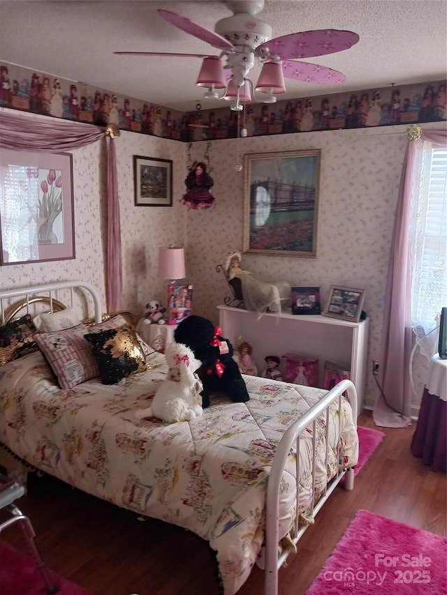 160 17th Street Pl NW Unit 3E, Hickory, NC 28601 - bedroom with ceiling fan, wood finished floors, and wallpapered walls