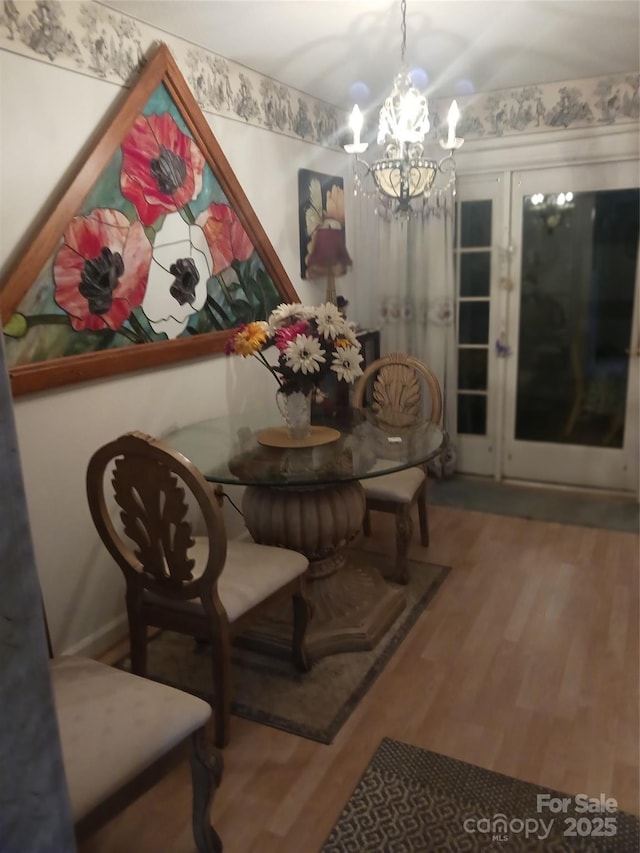 160 17th Street Pl NW Unit 3E, Hickory, NC 28601 - dining area featuring an inviting chandelier and wood finished floors