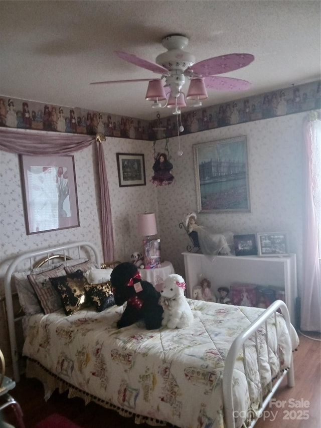 160 17th Street Pl NW Unit 3E, Hickory, NC 28601 - bedroom featuring wallpapered walls, ceiling fan, and wood finished floors