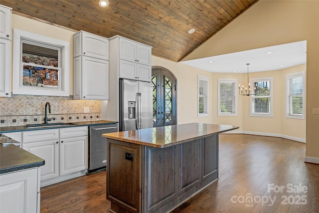 179 Serenity Ridge Trl, Asheville, NC 28804 - kitchen with appliances with stainless steel finishes, a sink, a chandelier, white cabinets, and recessed lighting