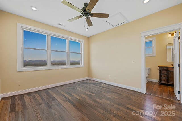 179 Serenity Ridge Trl, Asheville, NC 28804 - unfurnished bedroom featuring wood finished floors, baseboards, recessed lighting, connected bathroom, and ceiling fan