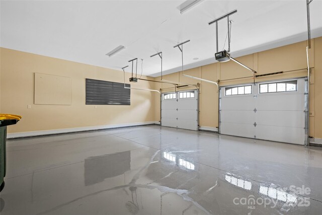 179 Serenity Ridge Trl, Asheville, NC 28804 - garage featuring a garage door opener and baseboards