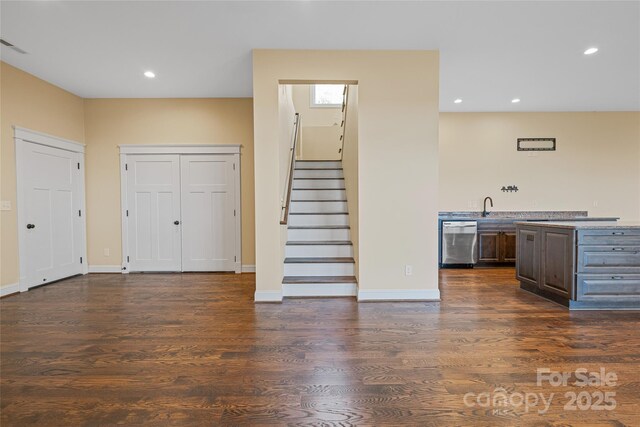 179 Serenity Ridge Trl, Asheville, NC 28804 - unfurnished living room with dark wood-type flooring, stairway, recessed lighting, and baseboards