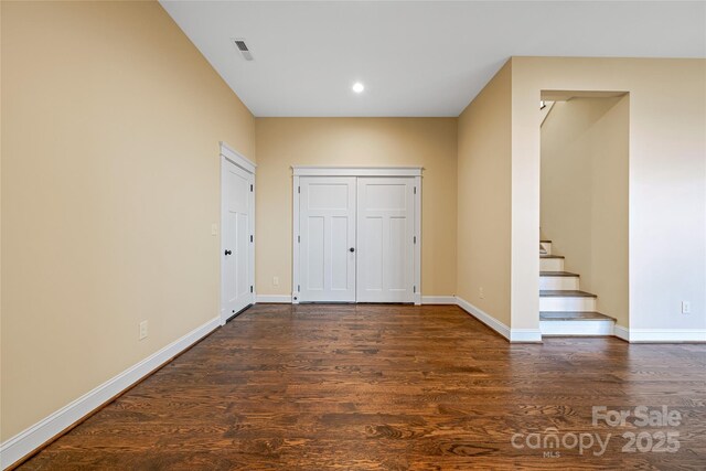 179 Serenity Ridge Trl, Asheville, NC 28804 - unfurnished bedroom with dark wood-style floors, baseboards, and recessed lighting