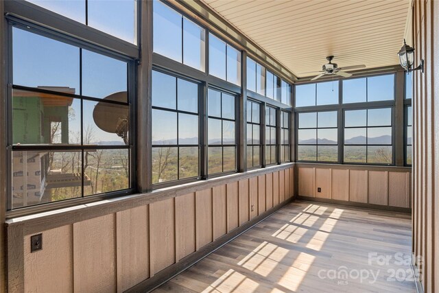 179 Serenity Ridge Trl, Asheville, NC 28804 - unfurnished sunroom featuring a ceiling fan and a mountain view
