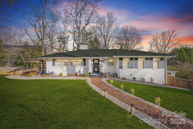 2 Bevlyn Dr, Asheville, NC 28803 - view of front of home with fence, a chimney, and a yard