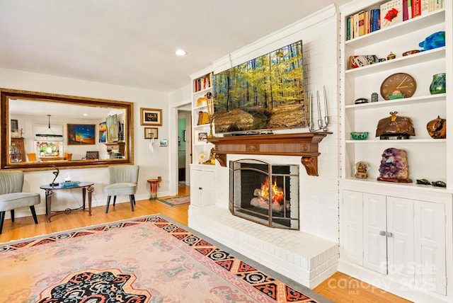 2 Bevlyn Dr, Asheville, NC 28803 - living room featuring baseboards, a brick fireplace, wood finished floors, and recessed lighting