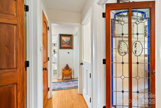 2 Bevlyn Dr, Asheville, NC 28803 - hallway featuring light wood-type flooring and baseboards