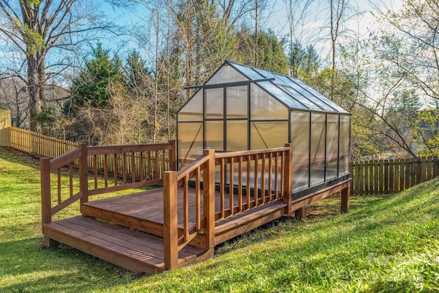 2 Bevlyn Dr, Asheville, NC 28803 - deck featuring an exterior structure, a yard, a fenced backyard, and an outdoor structure