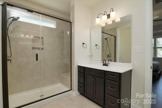 bathroom featuring ensuite bathroom, visible vents, vanity, a stall shower, and tile patterned flooring