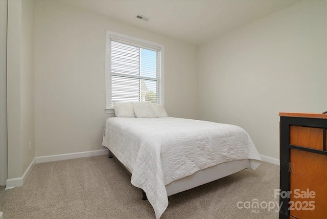 bedroom with baseboards, carpet floors, and visible vents