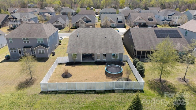 birds eye view of property with a residential view